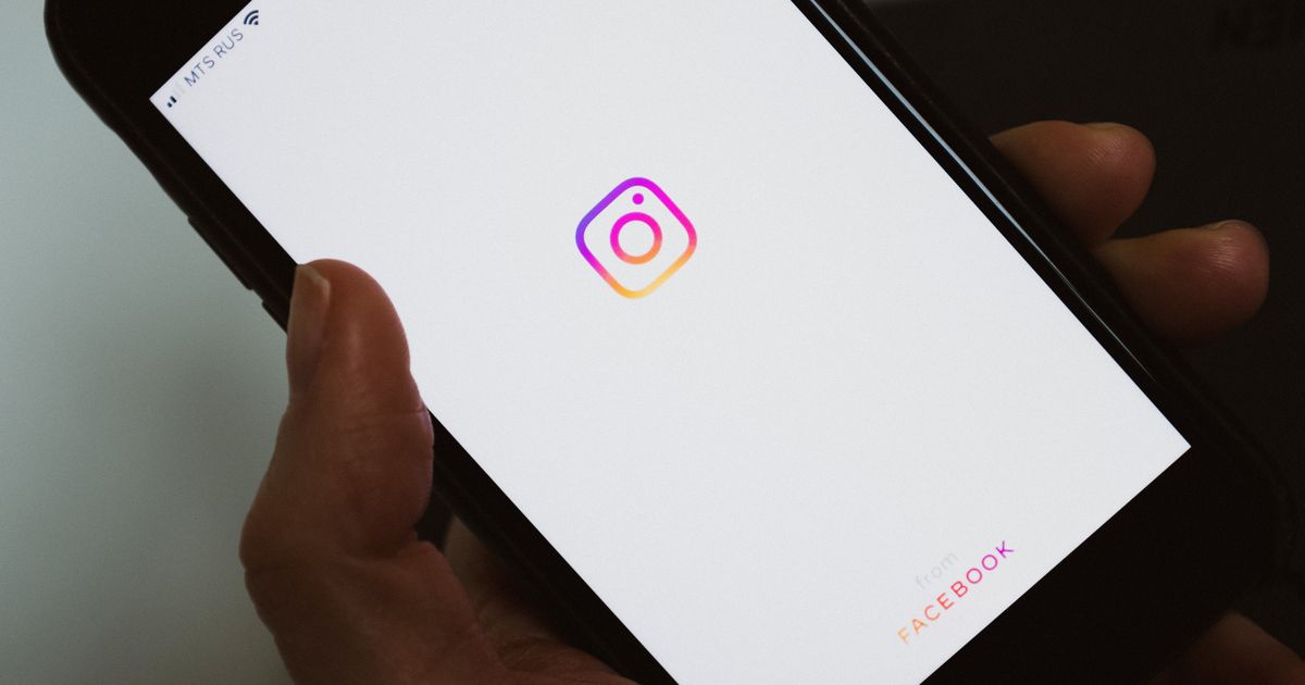Person checking social media and community activity on a phone