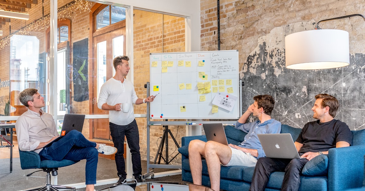 Business professionals in a meeting discussing outreach strategy