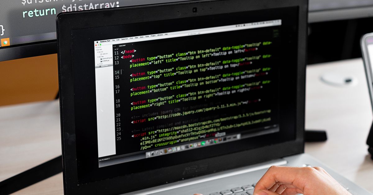 Solo technical founder writing code at a quiet home-office desk