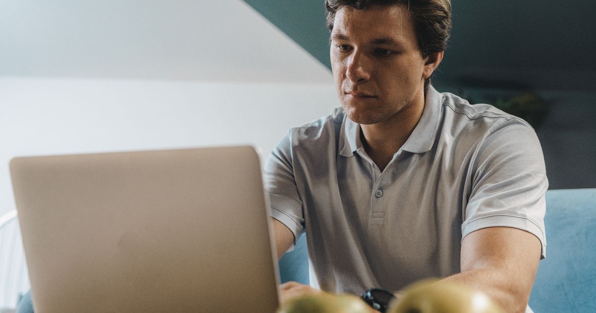Developer reviewing site code and crawler access settings on a monitor