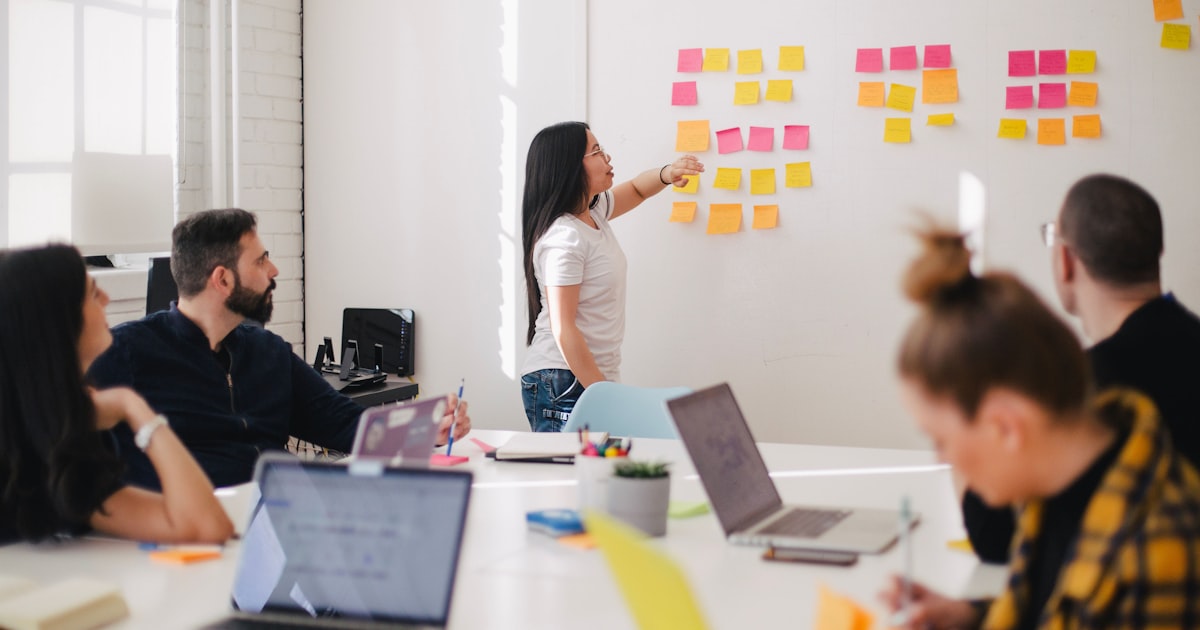 Business team discussing a partnership strategy around a conference table
