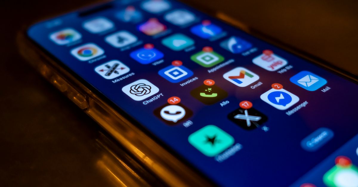 Smartphone showing email inbox with new message notifications